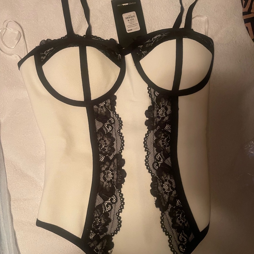 Fashion Nova White With Black trimming and lace bodysuit.
